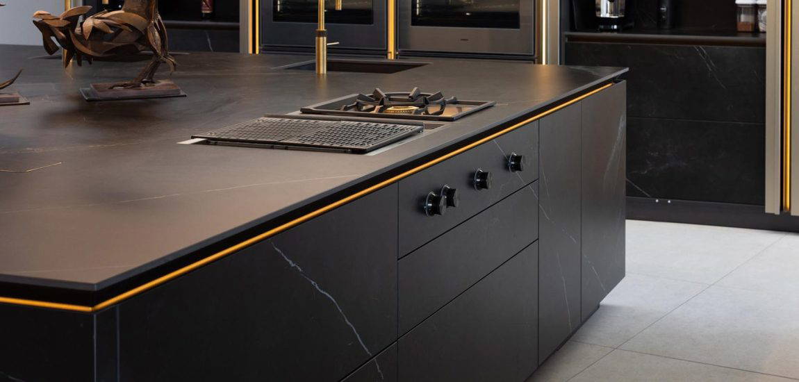 Architectural Elegance Meets Contemporary Design-006 Stuart Frazer SieMatic Kitchen | Island Detail - SieMatic SLX with vein-matched ceramic stone surfaces featuring a 400 Series Vario cooktop with gas griddle and Teppanyaki plate
